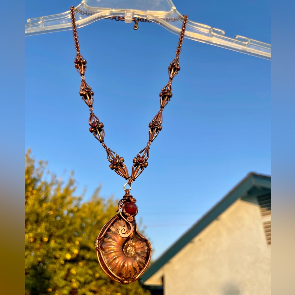 Unisex copper necklace deep red garnets embedded & ammonite fossil pendant.